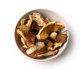 Bowl with tasty dried mushrooms on white background