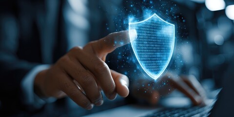 Businessperson's hand hovers over a holographic security shield composed of digital code