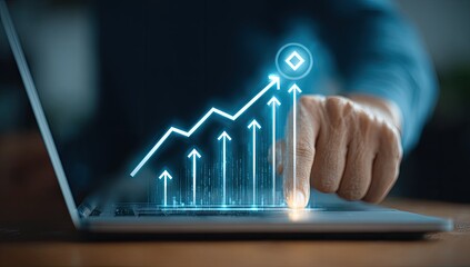 Hand touching a holographic chart of rising arrows on a laptop