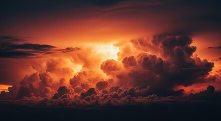 Fototapeta premium Dramatic sunset with fiery orange and dark clouds, atmospheric sky