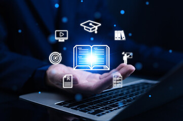 Digital education and online learning technology concept with glowing book and icons on laptop, symbolizing e-learning, knowledge sharing, training, and innovative study resources.