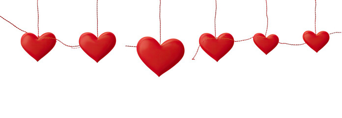 Red hearts hanging from strings against a black background