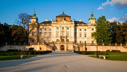Fototapeta premium Palace facade in park at golden hour