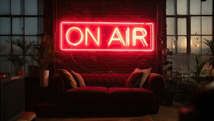 Red neon "On Air" sign above a velvet sofa in a stylish, industrial-chic room