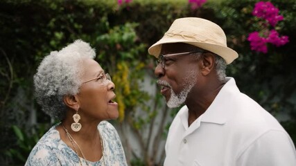 Serene Senior Couple in Conversation: A candid portrait of a loving, elderly couple engaging in an intimate conversation, filled with the gentle warmth of companionship and shared life experiences.