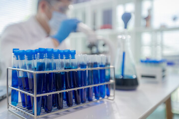 Scientists collaborating in laboratory, analyzing samples under microscope, conducting medical research and experiments for biotechnology, healthcare innovation, and scientific discovery.
