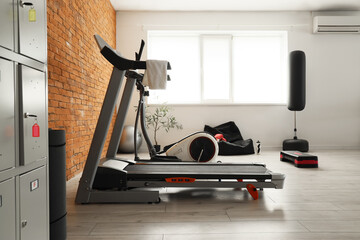 Interior of gym with sports equipment and beanbag