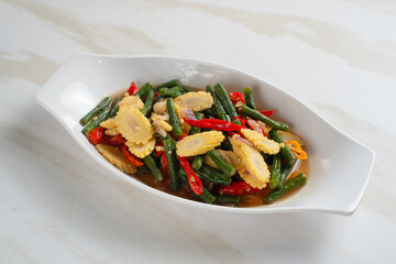 Homemade stir-fried long beans and baby corn. Perfect for recipes, articles or any cooking content.