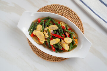 Homemade stir-fried long beans and baby corn. Perfect for recipes, articles or any cooking content.
