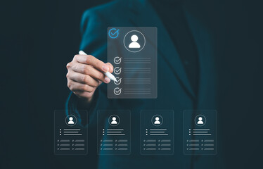 Businesswoman selecting digital resume with checklist on virtual screen, representing recruitment, job application process, digital HR solutions for modern human resource management