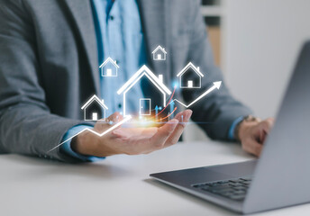 Businessman analyzing real estate data for mortgage and home insurance. Financial planning for real estate with market growth chart. Real estate investment concept.