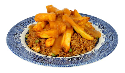 Egg fried rice and chips meal with Chinese curry sauce isolated on a white background