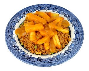 Egg fried rice and chips meal with Chinese curry sauce isolated on a white background