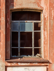 A window with a wooden frame and a glass pane