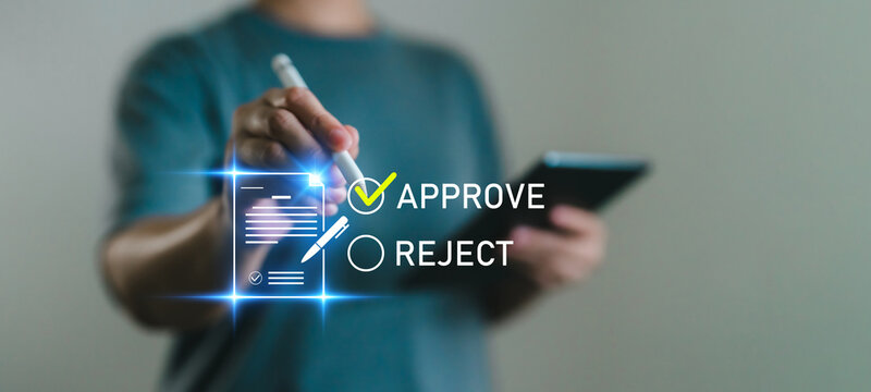 Digital approval process concept with hand selecting approve option on document using tablet and stylus for online verification, authorization or paperless workflow. E-signature, approval and reject.