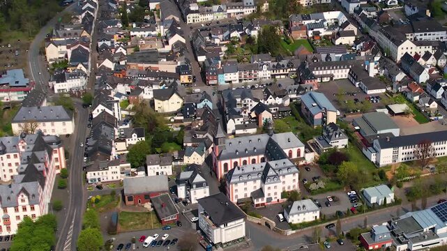 Aerial panoramic view around the old town and palace of the city Hadamar, Germany on a sunny spring morning