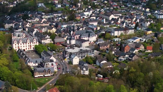 Aerial panoramic view around the old town and palace of the city Hadamar, Germany on a sunny spring morning