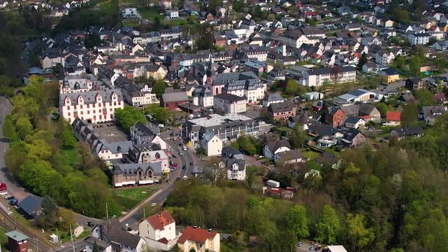 Aerial panoramic view around the old town and palace of the city Hadamar, Germany on a sunny spring morning