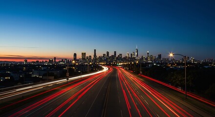 都会の夜景と高速道路の光跡写真