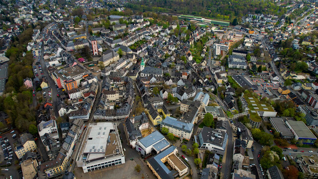 Aerial view around the old town of the city Siegen, Germany on a cloudy spring day