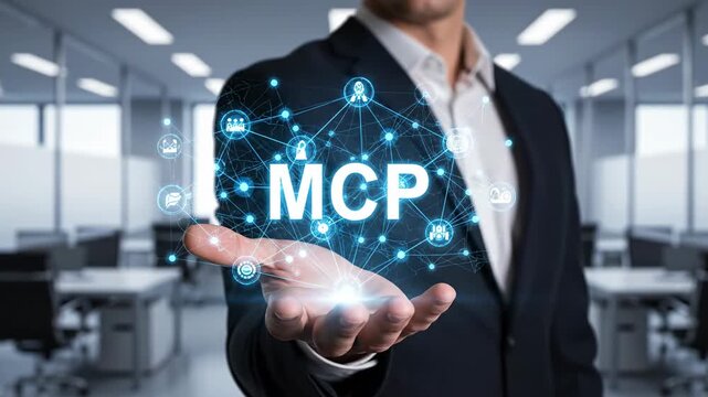 Businessman Presenting MCP Network - A businessman's open hand displays a digital network of connected icons, centered on the acronym MCP.