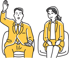 手を挙げて質問する男性会社員