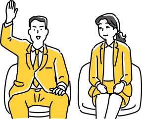 手を挙げて質問する男性会社員