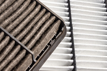 Man Comparing New and Old Engine Air Filters After Driving in Dusty Conditions © Dmitrii