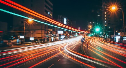 Obraz premium Nighttime City Traffic with Long Exposure, Vivid Urban Lights and Motion Blur Depicting a Dynamic Scene