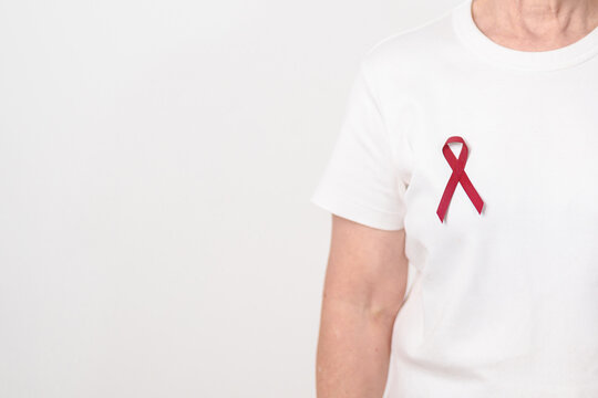 Elderly with Burgundy Ribbon for March Multiple Myeloma Cancer Awareness month, September Sickle Cell Anemia, Headache and Migraine week, April world Meningitis day, October Hospice Palliative care