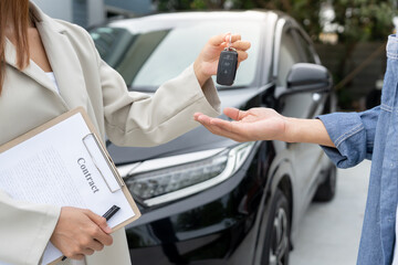 lease, rental car, sell, buy. Dealership manager send car keys to the new owner.  Sales, loan credit financial, rent vehicle, insurance,  renting, Seller, dealer, installment, car care business