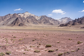 Colorful high altitude desert mountain landscape view along M41 aka Pamir Highway in summer, Murghab, Gorno-Badakhshan, Tajikistan