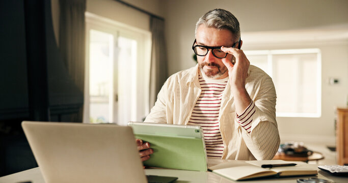 Remote work, business man and tablet in home for company report, risk mitigation or compliance. Freelance financial analyst, mature person or tech for reading funding request or investment evaluation