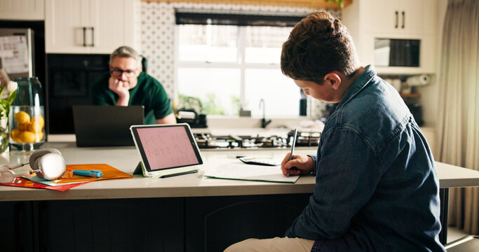 Education, tablet screen and boy writing in kitchen with remote work dad for learning or startup. Development, small business or study with father and son in apartment for assignment or project