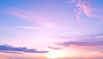 Fototapeta premium A serene, pastel-hued sky, filled with fluffy clouds, showcases a beautiful sunset.