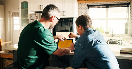 Homework, tablet and dad with son in home for help with elearning, education and lesson on website. Family, parenting and father with child on digital tech for online learning, assessment or studying