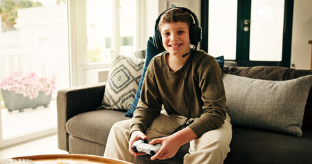 Portrait, video game and boy with controller, kid and entertainment with challenge. Home, headphones and child on sofa, online contest or sound with esports, click or smile with hobby or subscription