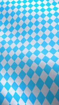 Vertical video animation of a Bavarian flag with diamond pattern in white and blue - seamless loop.
