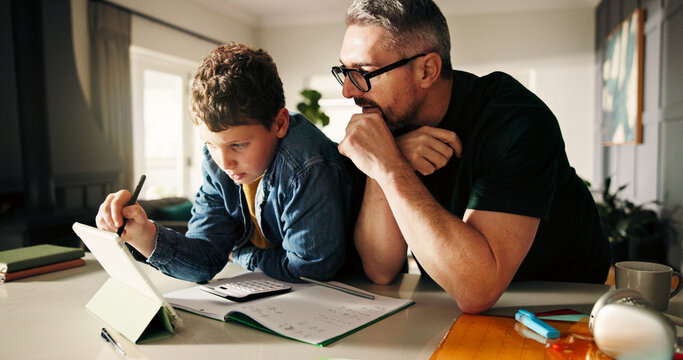 Tablet, homework and math with father and son in kitchen for learning app, education or teaching. Growth, online school schedule and support with man and kid in family home for reading and tutor - Powered by Adobe
