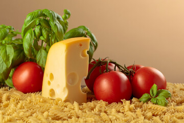 Ingredients for preparing traditional Italian pasta with cheese.