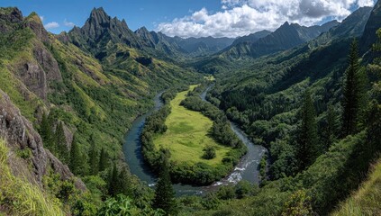 Lush valley with winding river, dramatic mountains