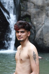 men in the waterfall