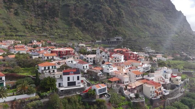 Aerial Drone Shot Rising Up Over Houses In Jardim Do Mar, Calheta, Madeira, Portugal On A Cloudy Day.