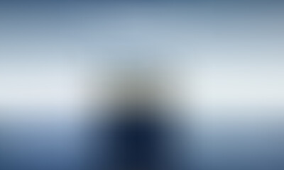 Solitary figure looking out at a vast, serene ocean under a bright sky