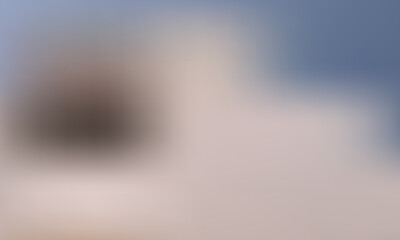 A person in silhouette stands on a snowy mountain peak, gazing at the vast sky above.