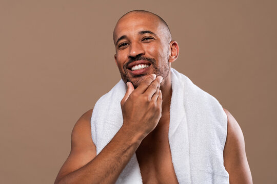Beauty portrait of middle-aged hispanic black handsome man on colored background, concepts about beauty treatment, skincare and cosmetics for men