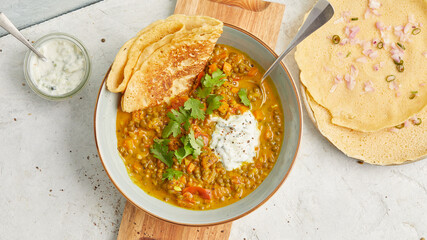 Lentil dal with chickpea pancakes