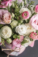 Beautiful arrangement of pink and white flowers in a decorative vase