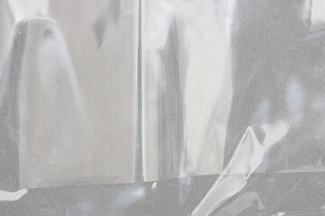 plastic overlay texture of realistic crumpled transparent plastic film wrap on black background
