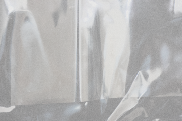 plastic overlay texture of realistic crumpled transparent plastic film wrap on black background